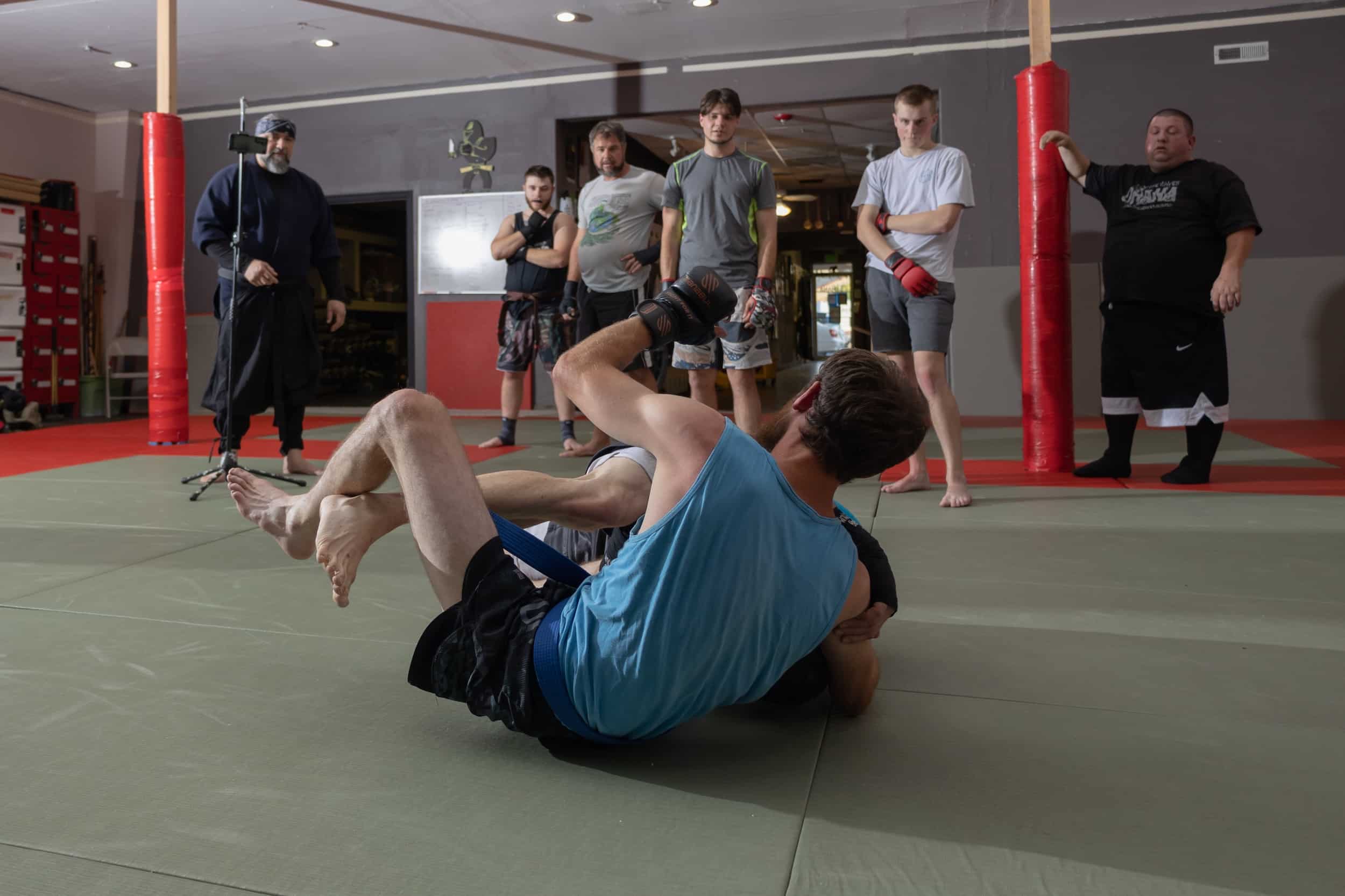homeland heroes jujutsu class students demonstrating with other students watching to learn proper techniques