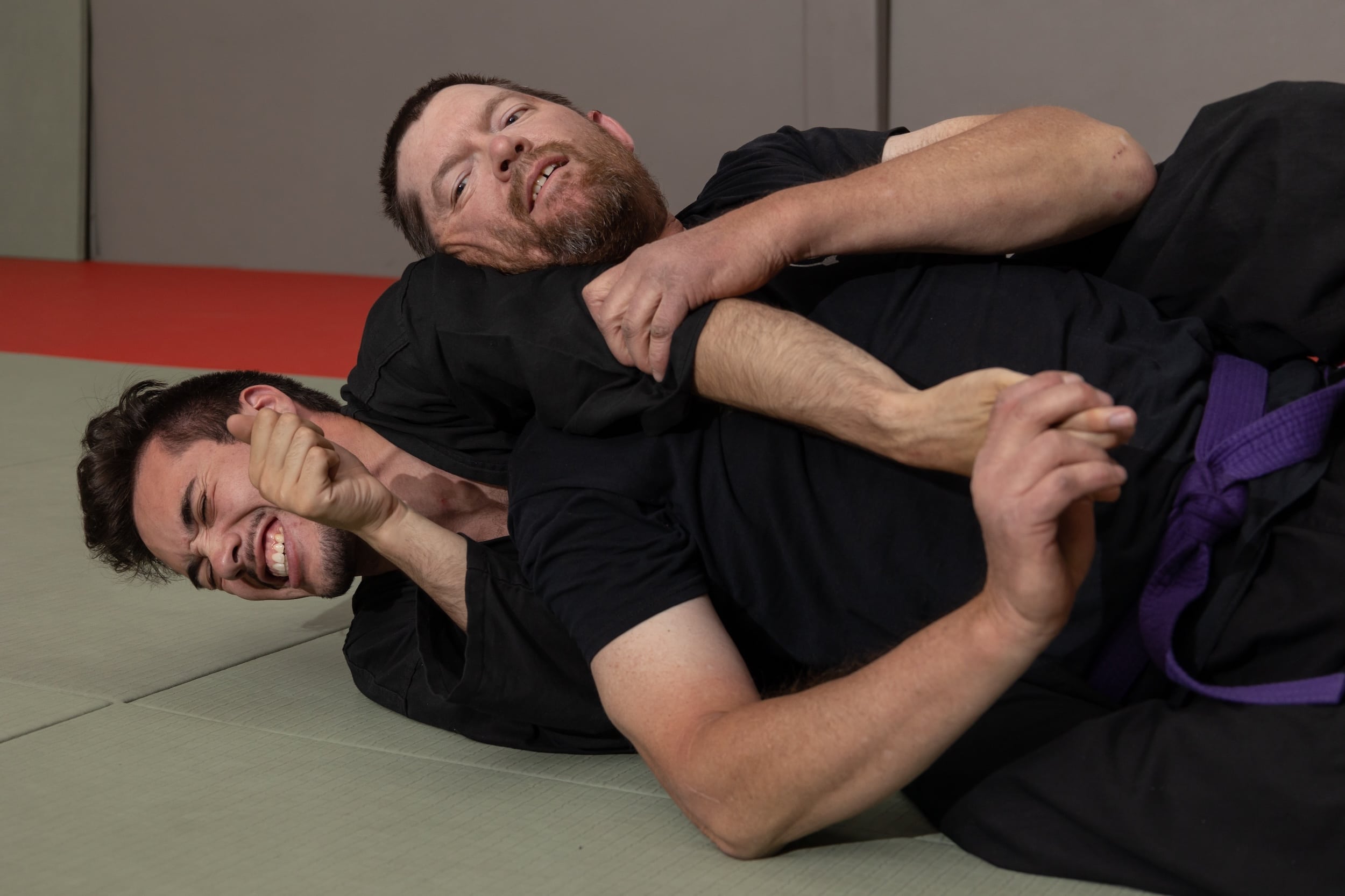 homeland heroes instructor putting homeland heroes student in grappling hold in jujutsu class