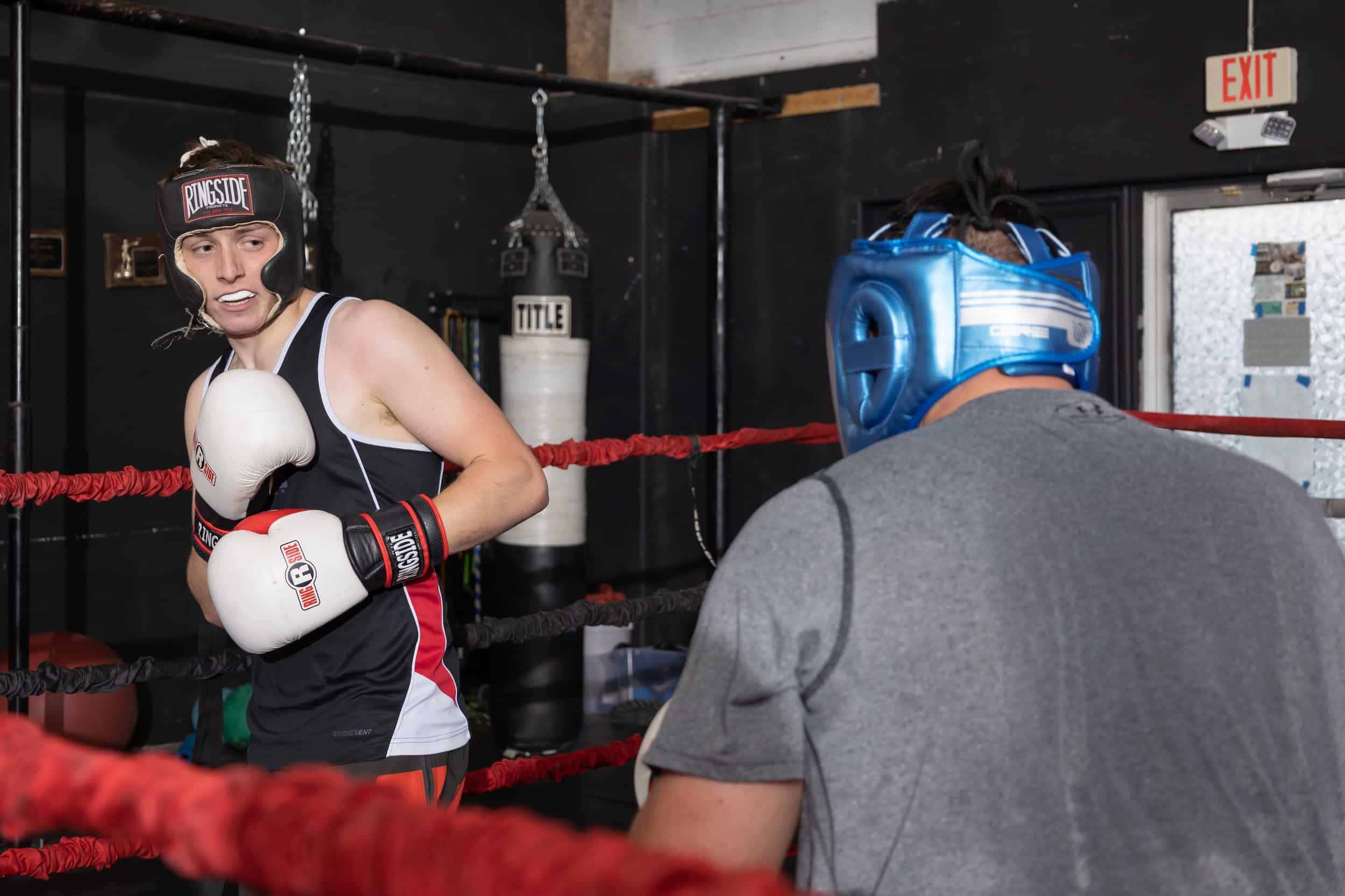 homeland heroes boxing class with two male students parring in ring