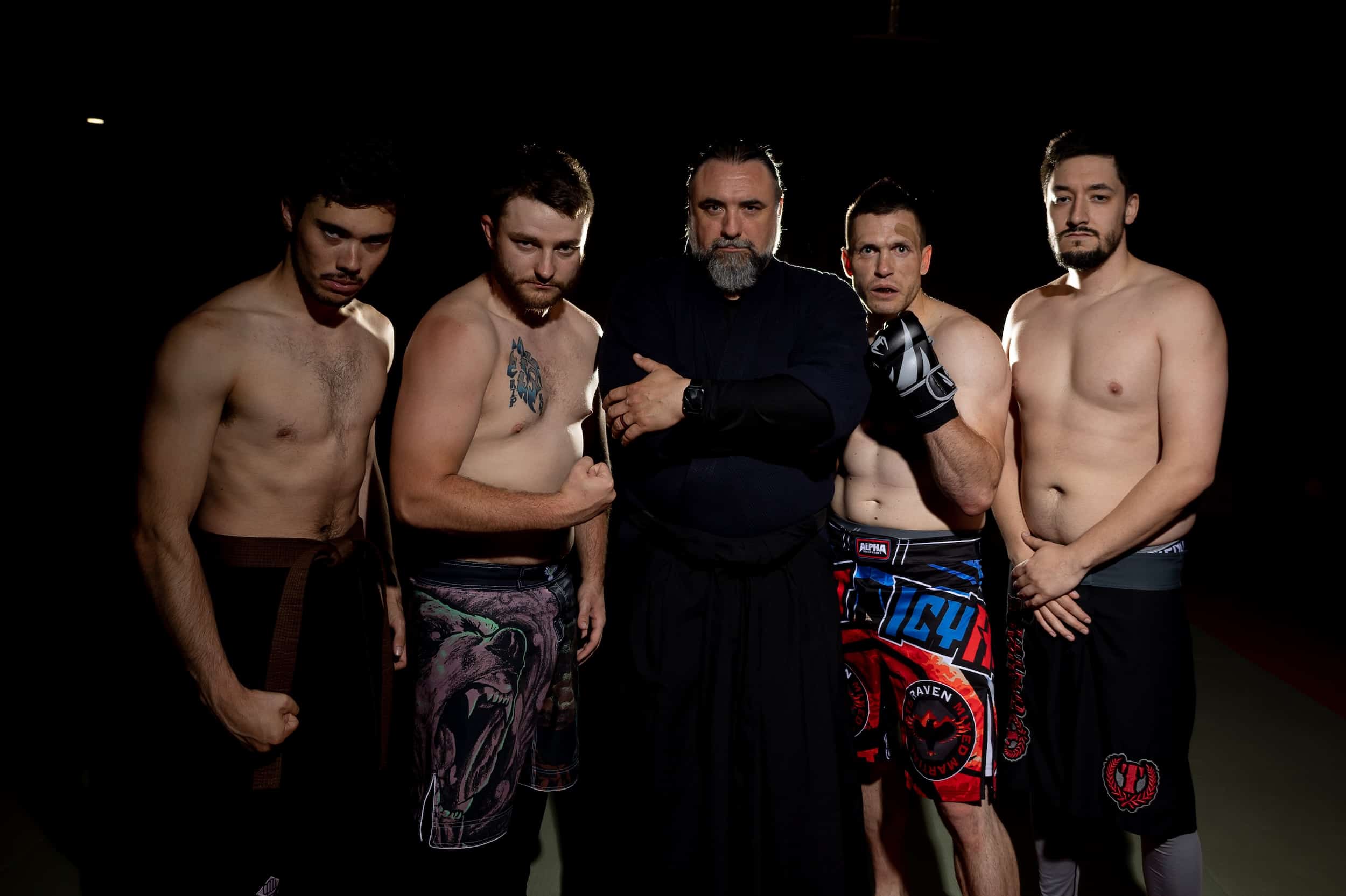 Homeland Heroes instructor poses with mma students