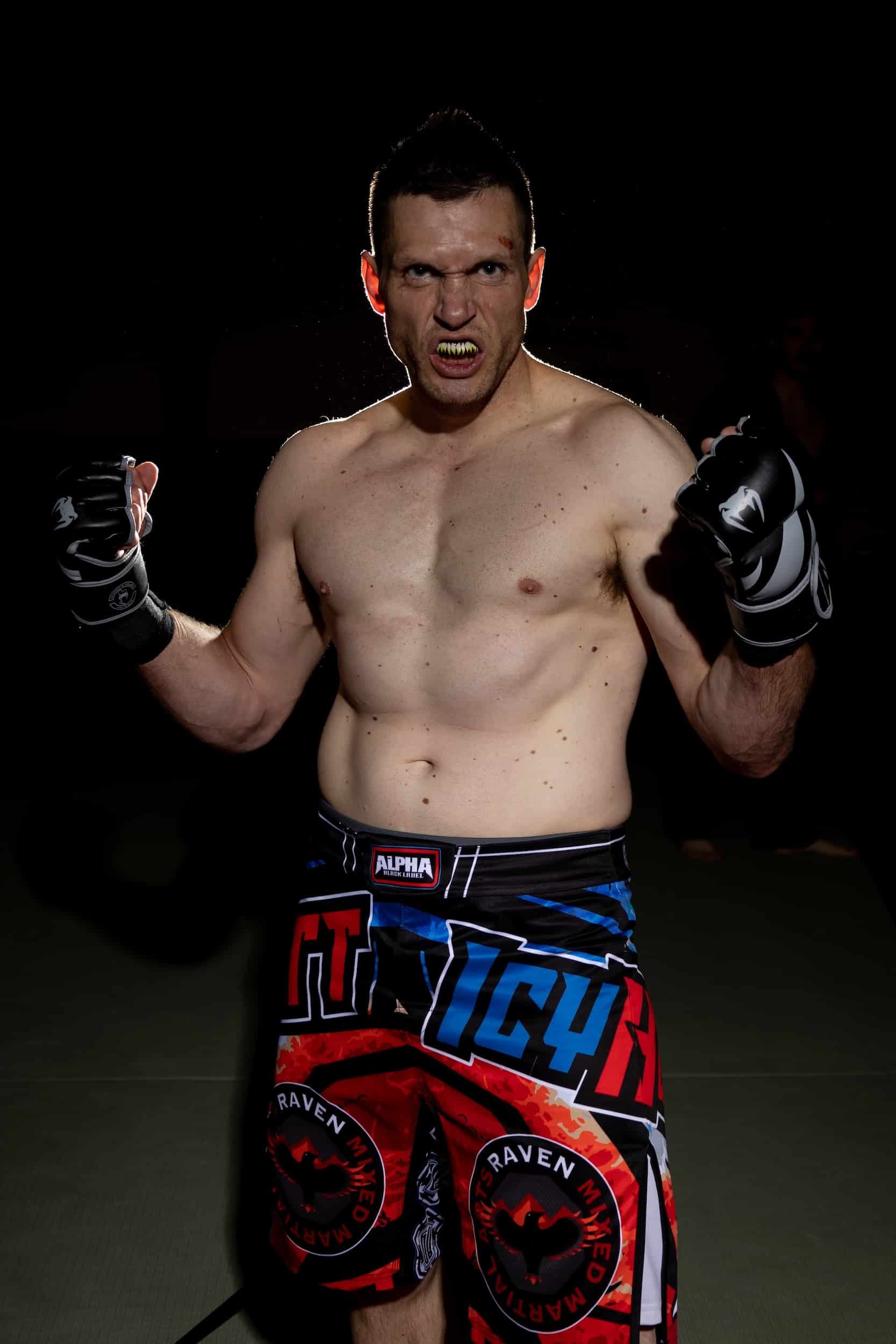 Homeland Heroes mma student posing with fists in the air