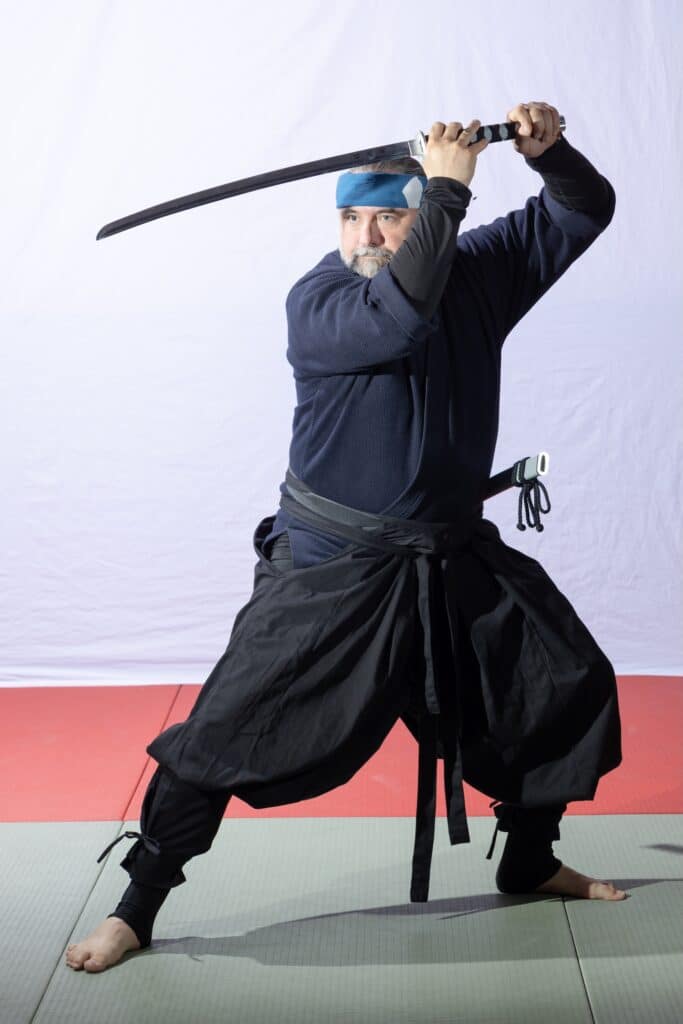 Homeland Heroes instructor posing with a sword