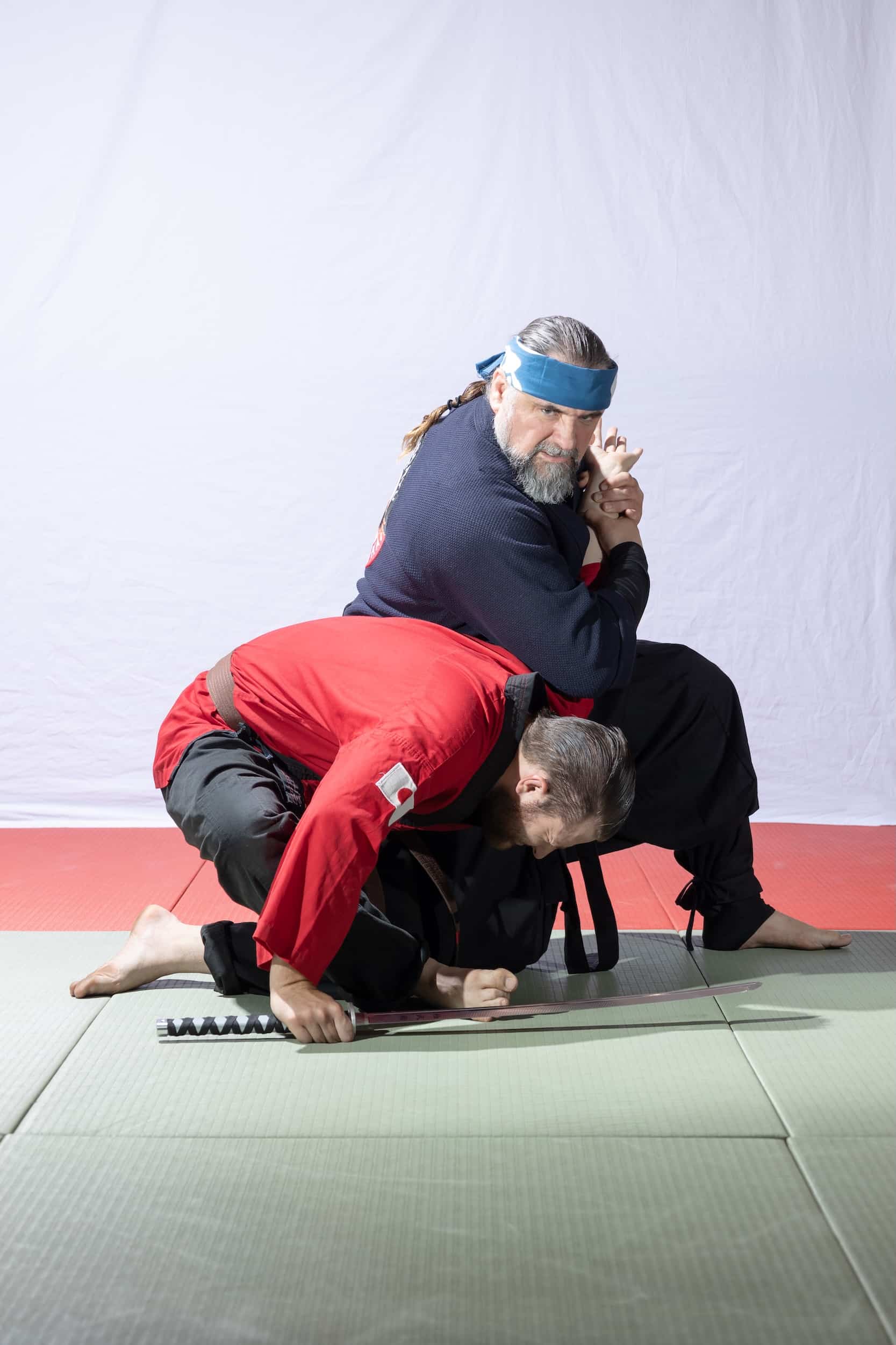 student in grappling hold from instructor in homeland heroes class