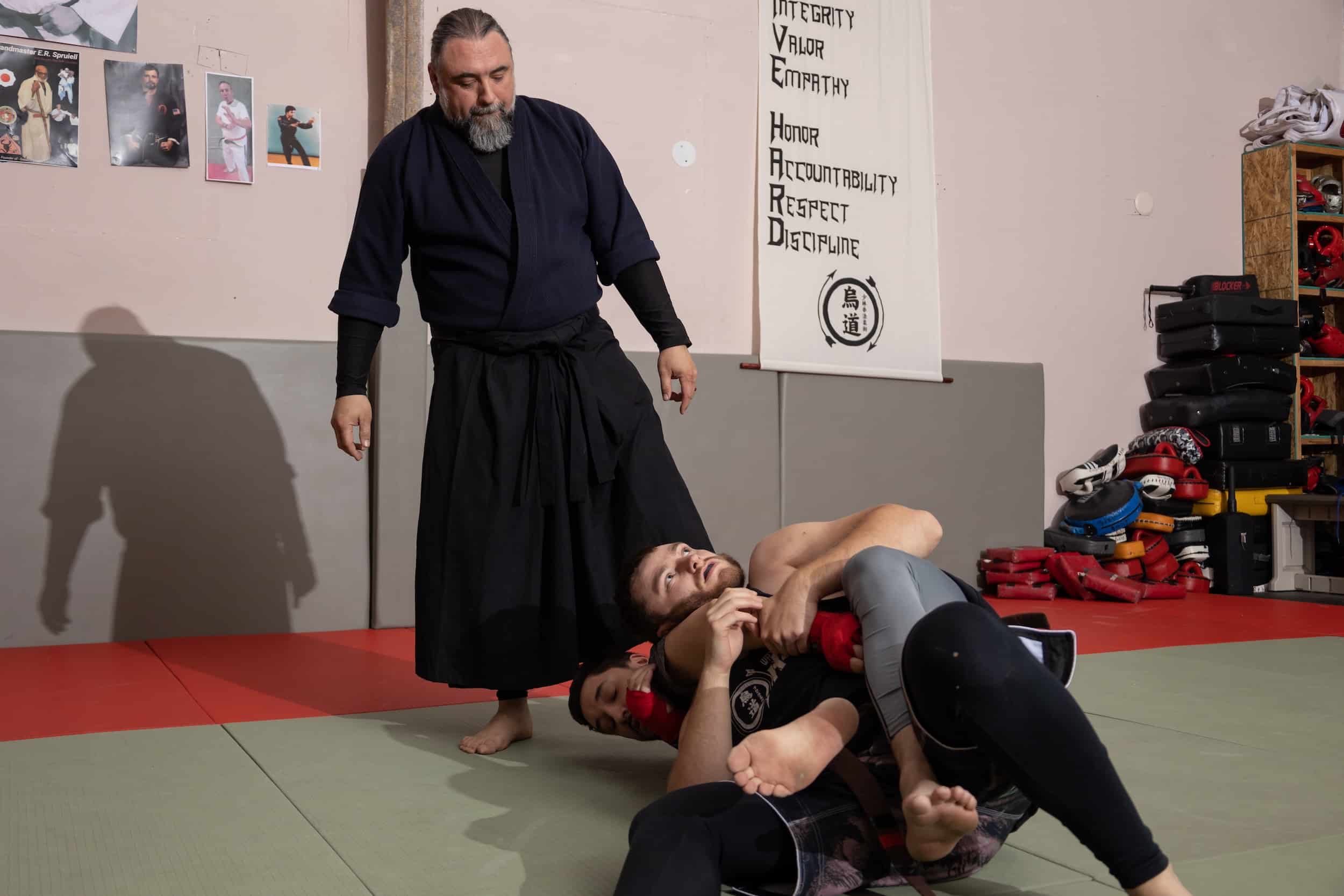 Homeland Heroes instructor watching students spar during jujutsu