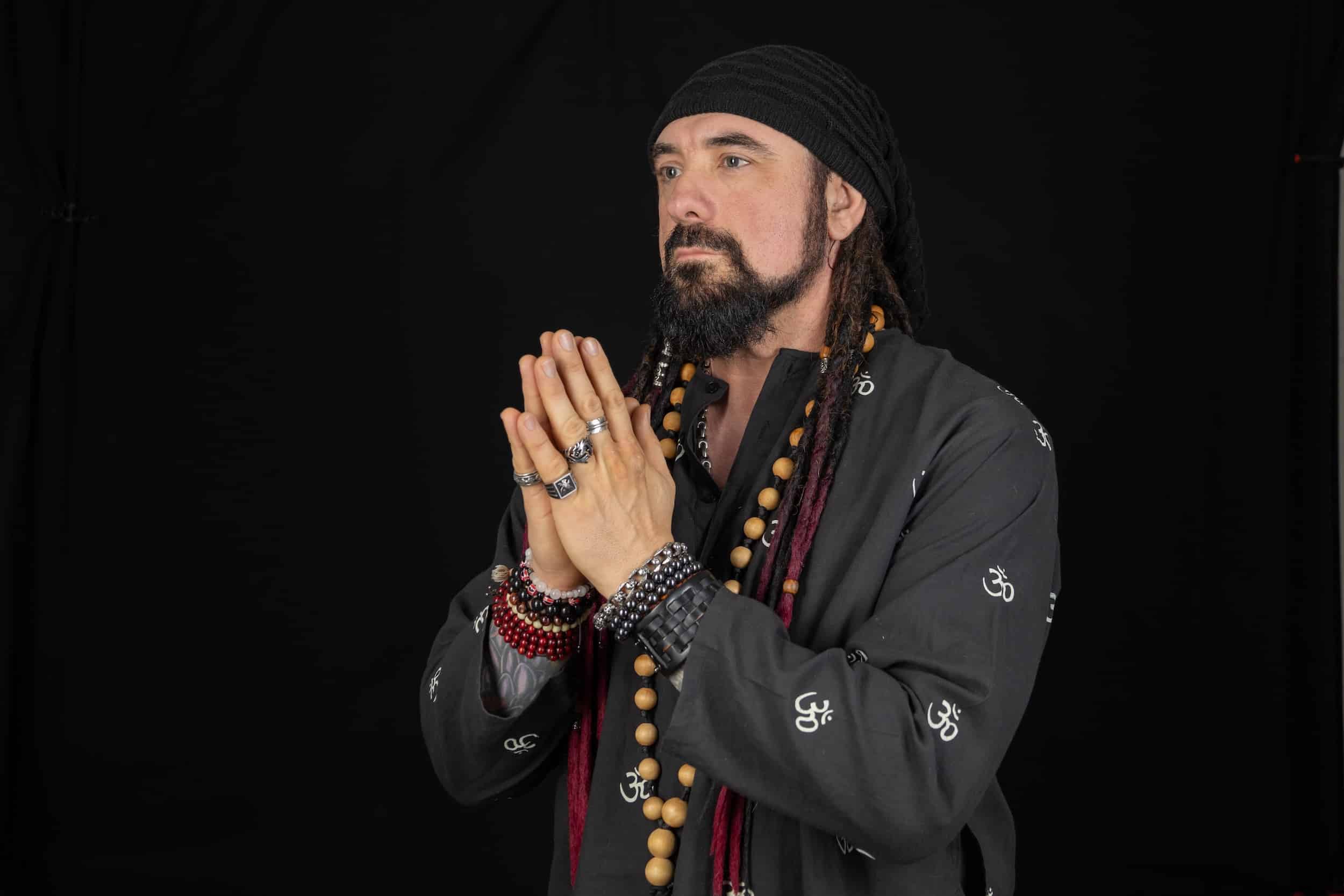 Homeland Heroes Owner Raven Cain holding hands together for his Life Coaching offering